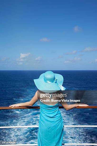 woman looking out to sea on a cruise ship - luxury cruise ship stock pictures, royalty-free photos & images