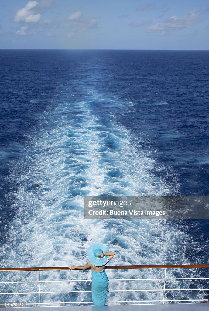 Woman in awe of the ocean view on a cruise ship