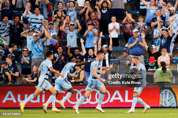 Andreu Fontàs of Sporting Kansas City celebrates with teammates after scoring the game's second goal against Portland Timbers during the first half...
