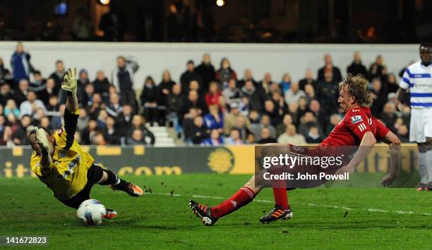 Dirk Kuyt of Liverpool scores the second goal during the Barclays Premier League match between Queens Park Rangers and Liverpool at Loftus Road on...