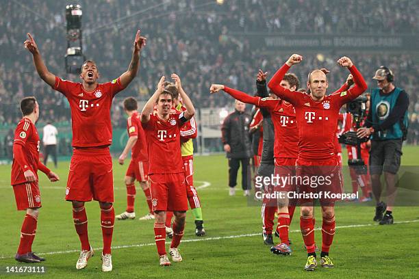 Jérome Boateng, Philipp Lahm and Arjen Robben of Bayern celebrate the 4-2 victory after penalty shoot-out after the DFB Cup semi final match between...