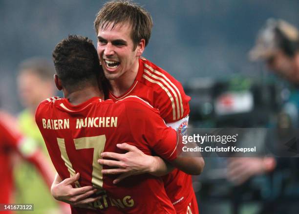 Jérome Boateng and Philipp Lahm of Bayern celebrate the 4-2 victory after penalty shoot-out after the DFB Cup semi final match between Borussia...