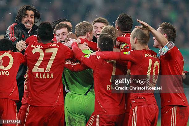 Franck Ribery of Bayern embraces Manuel Neuer after winning 4-2 after penalty shoot-out after the DFB Cup semi final match between Borussia...