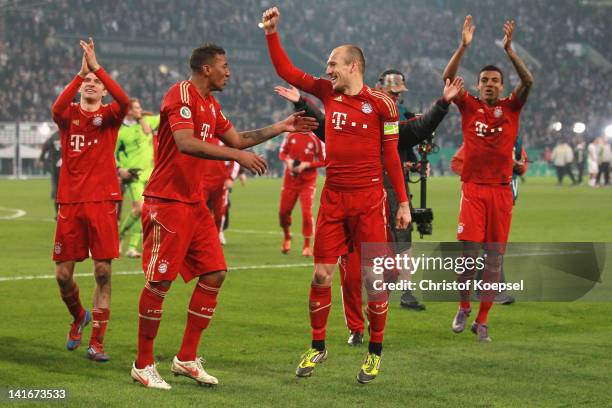 Jérome Boateng and Arjen Robben of Bayern celebrate the 4-2 victory after penalty shoot-out after the DFB Cup semi final match between Borussia...