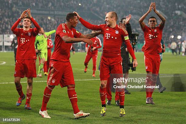Jérome Boateng and Arjen Robben of Bayern celebrate the 4-2 victory after penalty shoot-out after the DFB Cup semi final match between Borussia...