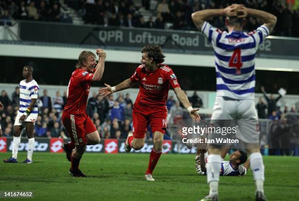 Sebastian Coates of Liverpool celebrates scoring the first goal during the Barclays Premier League match between Queens Park Rangers and Liverpool at...