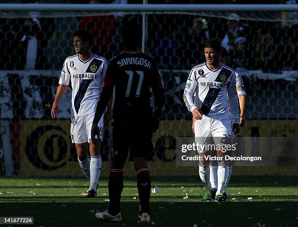 David Beckham and Andrew Boyens of the Los Angeles Galaxy walk upfield during the MLS match against D.C. United at The Home Depot Center on March 18,...