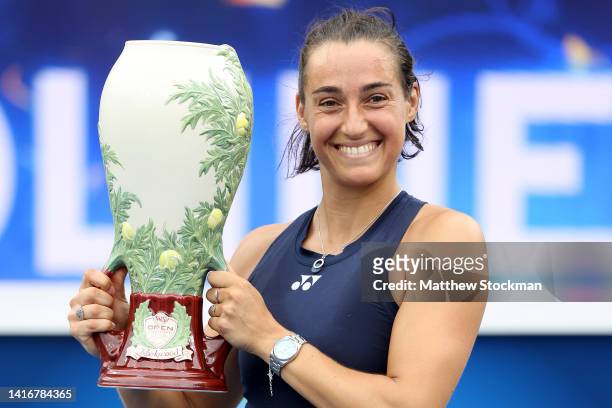 Caroline Garcia of France holds the winner's trophy after defeating Petra Kvitova of Czech Republic during the women's final of the Western &...