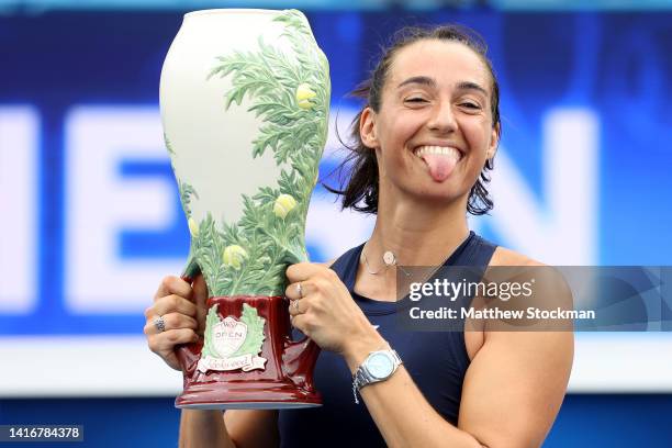 Caroline Garcia of France holds the winner's trophy after defeating Petra Kvitova of Czech Republic during the women's final of the Western &...