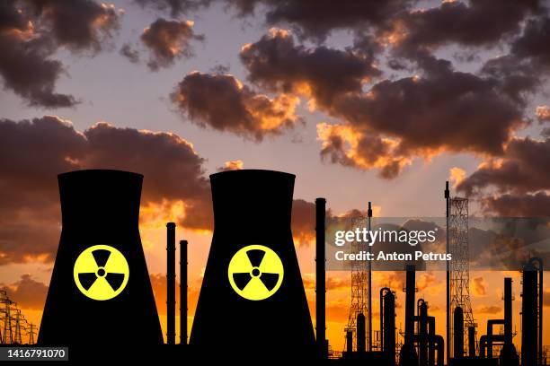 nuclear power plant on the background of sunset - radiation symbol stock pictures, royalty-free photos & images