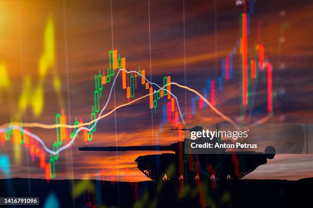 armored tank on the background of stock charts - weapon stock pictures, royalty-free photos & images