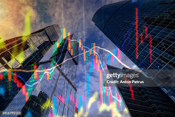 default in russia. stock charts on the background of skyscrapers. - punishment stocks photos et images de collection