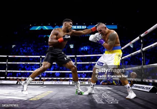 Anthony Joshua punches Oleksandr Usyk during the Rage on the Red Sea Heavyweight Title Fight at King Abdullah Sports City Arena on August 20, 2022 in...