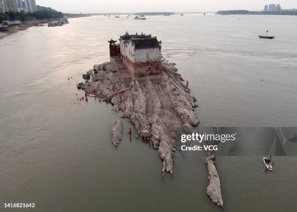 Aerial view of the Guanyin Pavilion, which has stood on the Yangtze River for over 700 years, reappearing from underwater as China's Yangtze River...