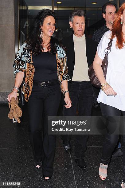 Actor and singer Randy Travis and Mary Beougher leave the "Good Morning America" taping at the ABC Times Square Studios on March 21, 2012 in New York...