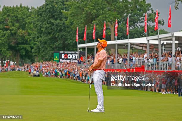 Golfer Rickie Fowler reacts on the 18th green after winning in a 3 way playoff on July 2 during the final round of the Rocket Mortgage Classic at the...