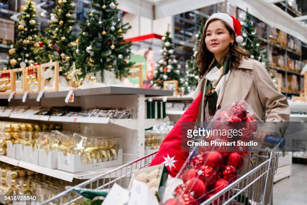 happy young woman  doing  shopping at  christmas market - christmas shopping stock pictures, royalty-free photos & images