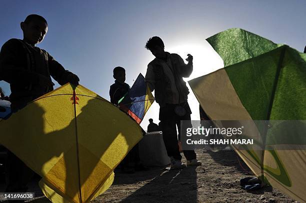 With Afghanistan-social-leisure-NewYear by Joris Fioriti In this picture taken on March 21, 2012 Afghan teenagers prepare to fly their kites on a...
