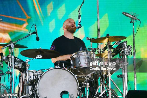 Will Champion of Coldplay performs on stage at Wembley Stadium