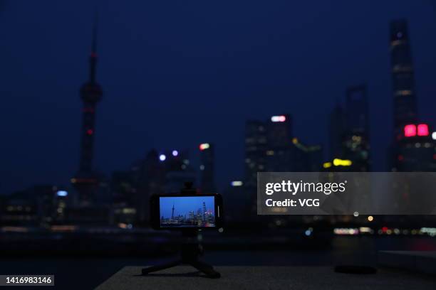 Decorative lights are turned off at the Bund on August 22, 2022 in Shanghai, China. Shanghai will switch off decorative lights for its landmark areas...