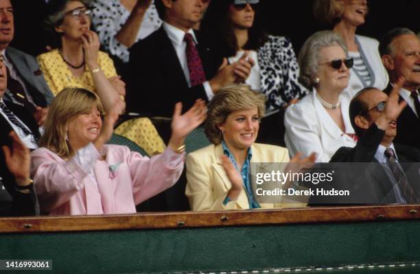 View of Diana, Princess of Wales as she applauds during a women's tennis match at Wimbledon, London, England, July 1987.