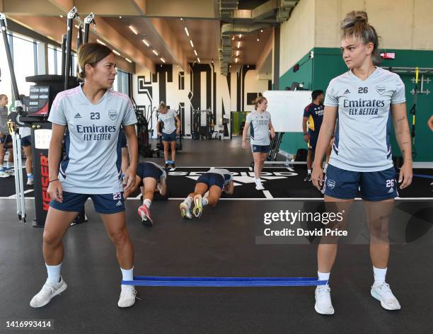 Mana Iwabuchi and Laura Wienroither of Arsenal during the Arsenal Women's Pre Season training session at Adidassler Sportplatz on August 22, 2022 in...