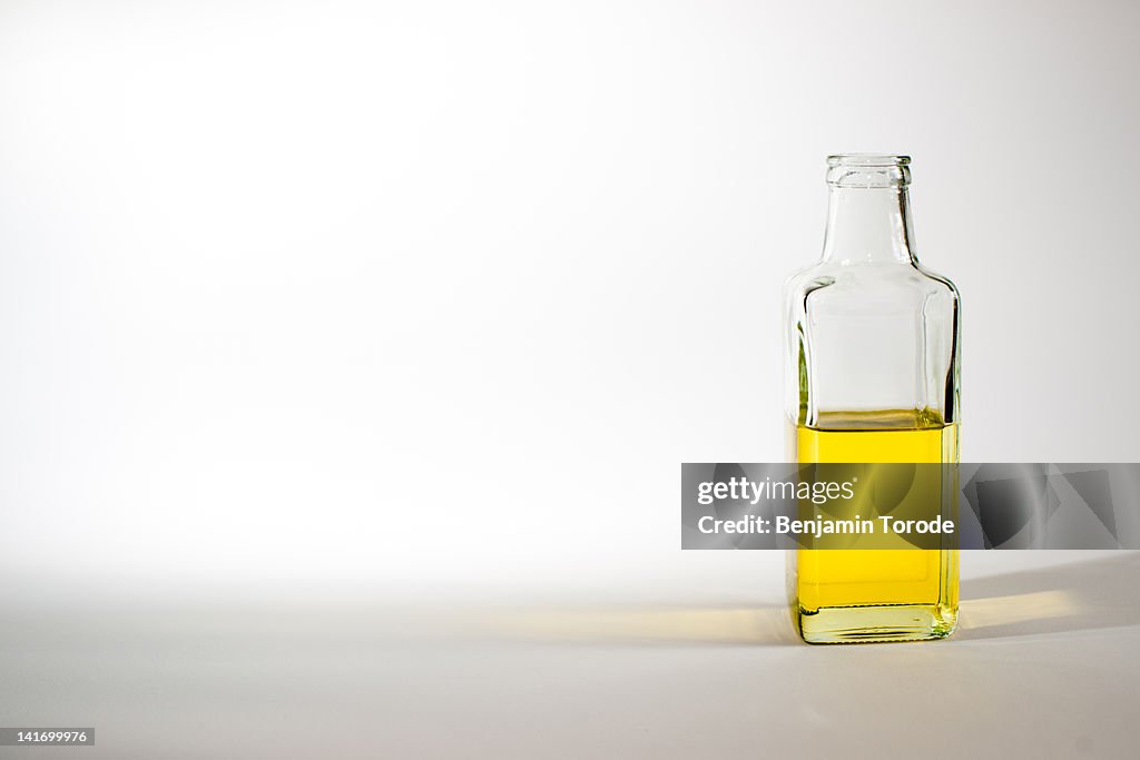 Half full bottle of olive oil