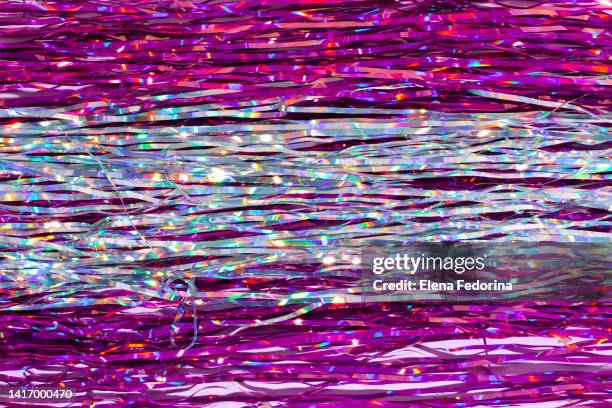 festive pink background with tinsel. - tinsel stock pictures, royalty-free photos & images