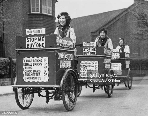 Three female Wall's Ice-Cream sales vendors riding tricycles on their 'Stop Me And Buy One' rounds to continue servicing customers, having taken over...