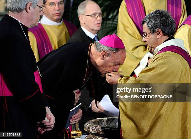 Archbishop Andre-Joseph Leonard attends on March 22, 2012 at the Sint-Pieters church in Leuven during a funeral service for the seven children from...