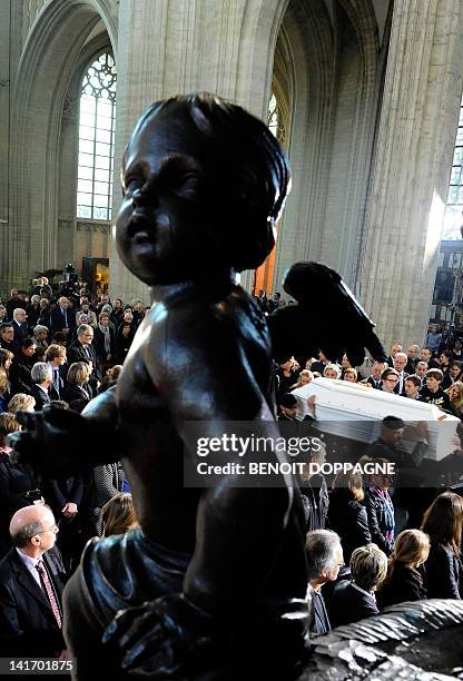 Coffin is carried on March 22, 2012 into the Sint-Pieters church in Leuven during a funeral service for the seven children from Heverlee, who were...