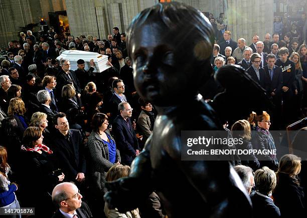 Coffin is carried on March 22, 2012 into the Sint-Pieters church in Leuven during a funeral service for the seven children from Heverlee, who were...