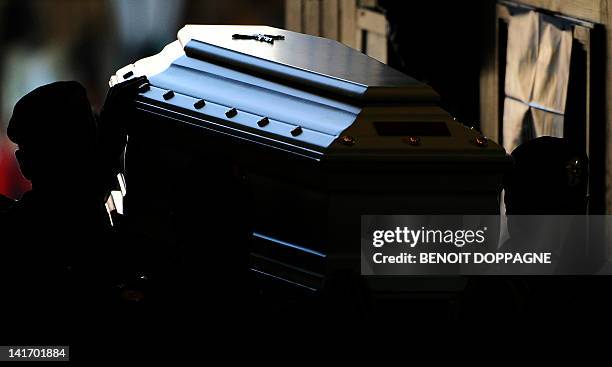 Coffin is carried on March 22, 2012 into the Sint-Pieters church in Leuven during a funeral service for the seven children from Heverlee, who were...