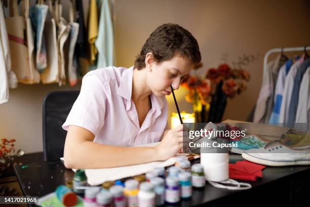 woman customizing reusable bags in her atelier - sustentabilidade stock pictures, royalty-free photos & images