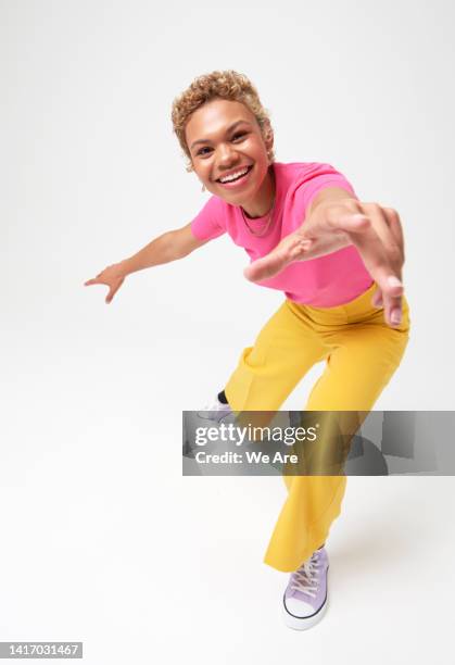 woman reaching hand toward camera - woman reaching stock pictures, royalty-free photos & images