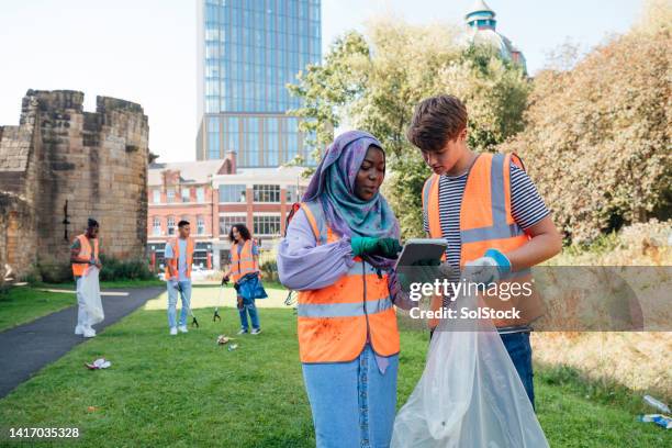 planning a cleanup strategy - volunteerism stock pictures, royalty-free photos & images