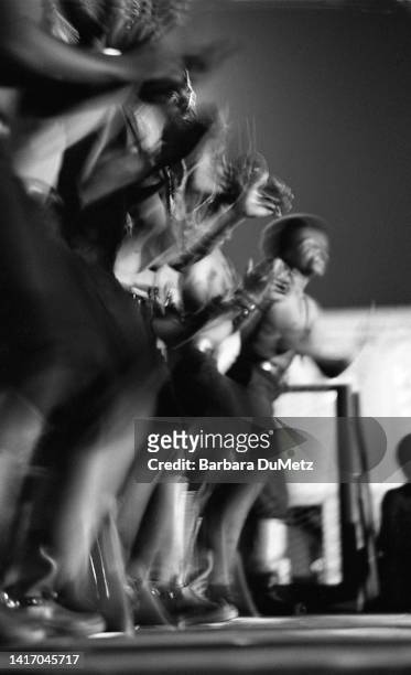 View the members of a boot dancing troop as they perform on stage during the the Watts Summer Festival at Will Rogers Memorial Park , Los Angeles,...