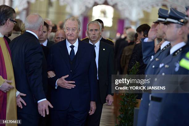 King Albert II of Belgium greet the Swiss emergency services on March 22, 2012 at the Sint-Pieters church in Leuven during a funeral service for the...