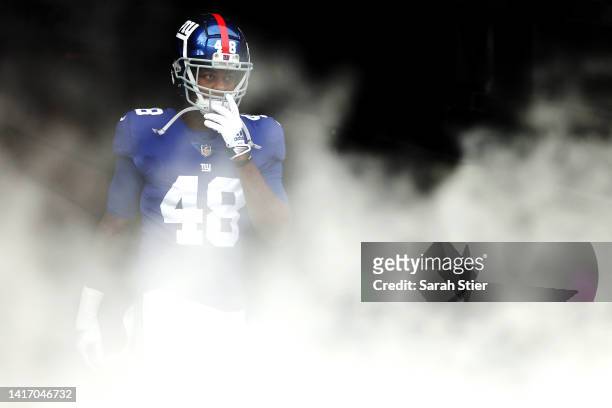 Tae Crowder of the New York Giants takes the field during the first half of a preseason game against the Cincinnati Bengals at MetLife Stadium on...