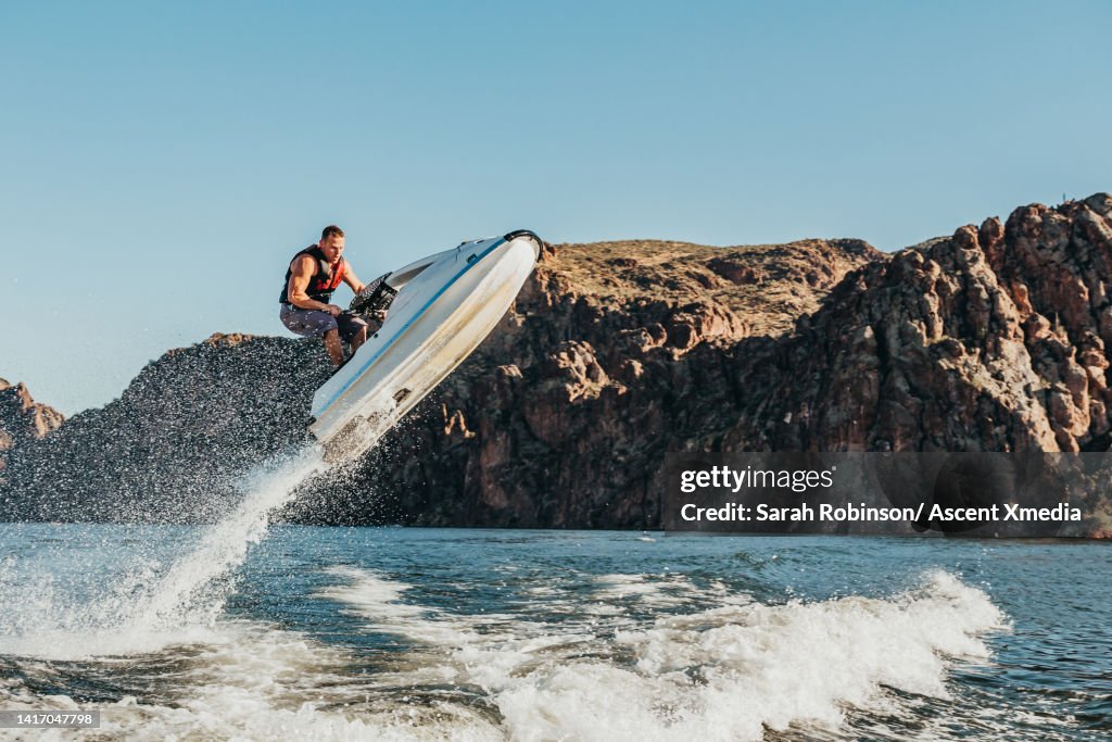 Jet skier gets air off of a wave