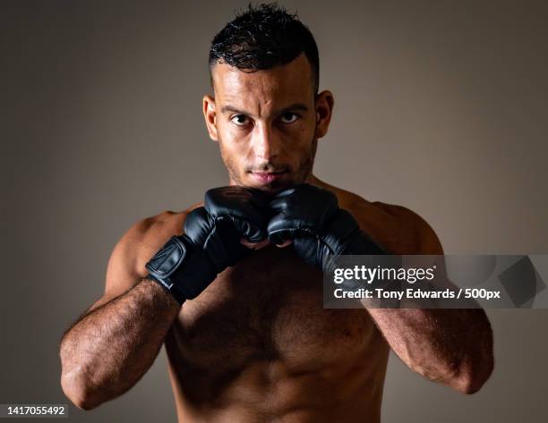 portrait of a bodybuilder,phuket,thailand - mixed martial arts stock pictures, royalty-free photos & images