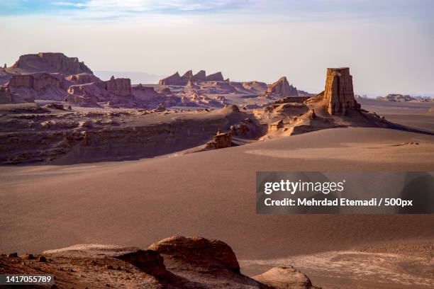 scenic view of rock formations against sky,kerman province,iran - iran landschaft stock-fotos und bilder