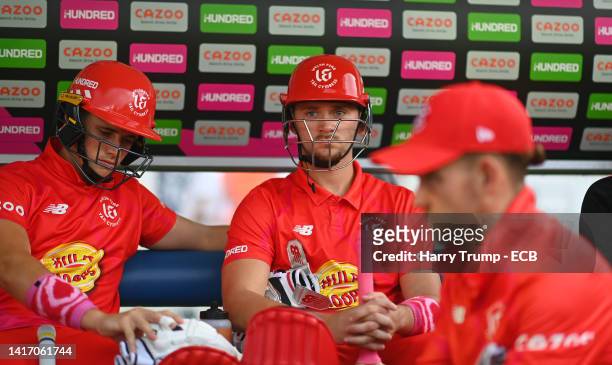 Joe Clarke and Jacob Bethell of Welsh Fire look on before The Hundred match between Welsh Fire Men and Southern Brave Men at Sophia Gardens on August...