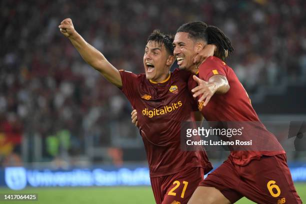Roma players Paulo Dybala and Chris Smalling celebrate during the Serie A match between AS Roma and US Cremonese at Stadio Olimpico on August 22,...