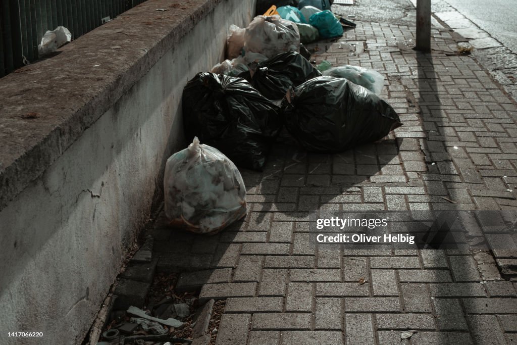 Rubbish bags dumped on a pavement in the centre of Naples, Italy