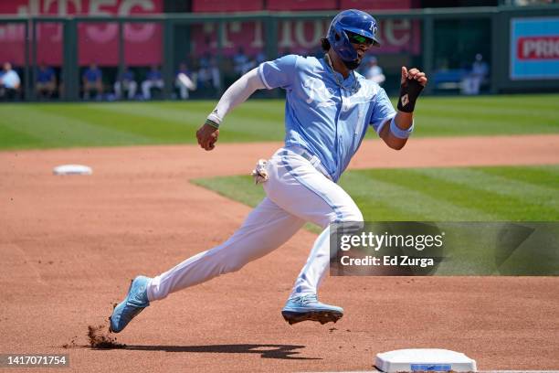 Melendez of the Kansas City Royals rounds third as he heads home to score on a Salvador Perez of the Kansas City Royals single in the first inning...