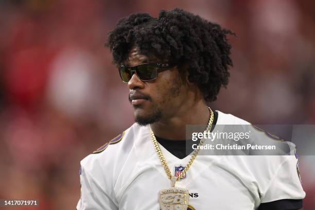 Quarterback Lamar Jackson of the Baltimore Ravens on the sidelines during the first half of the NFL preseason game against the Arizona Cardinals at...