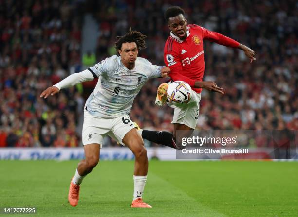 Trent Alexander-Arnold of Liverpool battles for possession with Anthony Elanga of Manchester United during the Premier League match between...