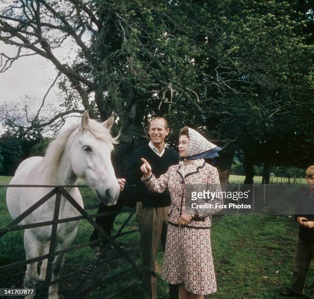 Queen Elizabeth II and Prince Philip visit a farm on the Balmoral estate in Scotland, during their Silver Wedding anniversary year, September 1972.
