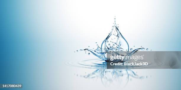 water drop splash. on the blue background. - water splashing stock pictures, royalty-free photos & images